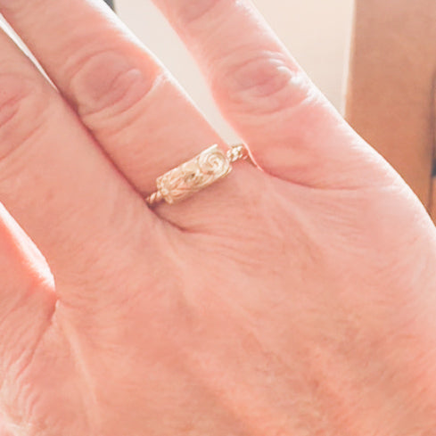 Twisted floral horizontal ring